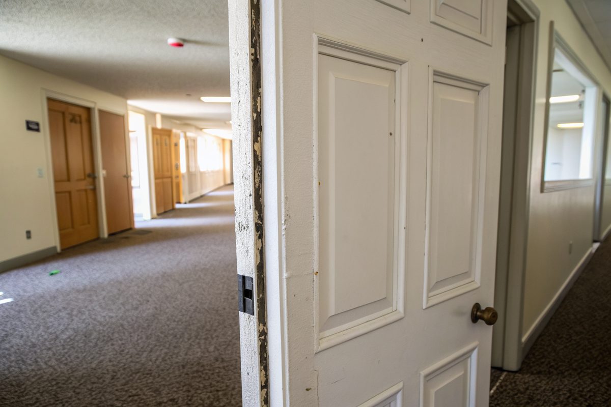 An interior door with a tapered gap along the top of its frame